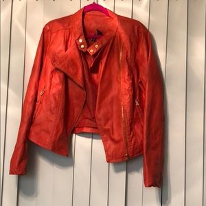 Orange faux leather jacket with gold accents